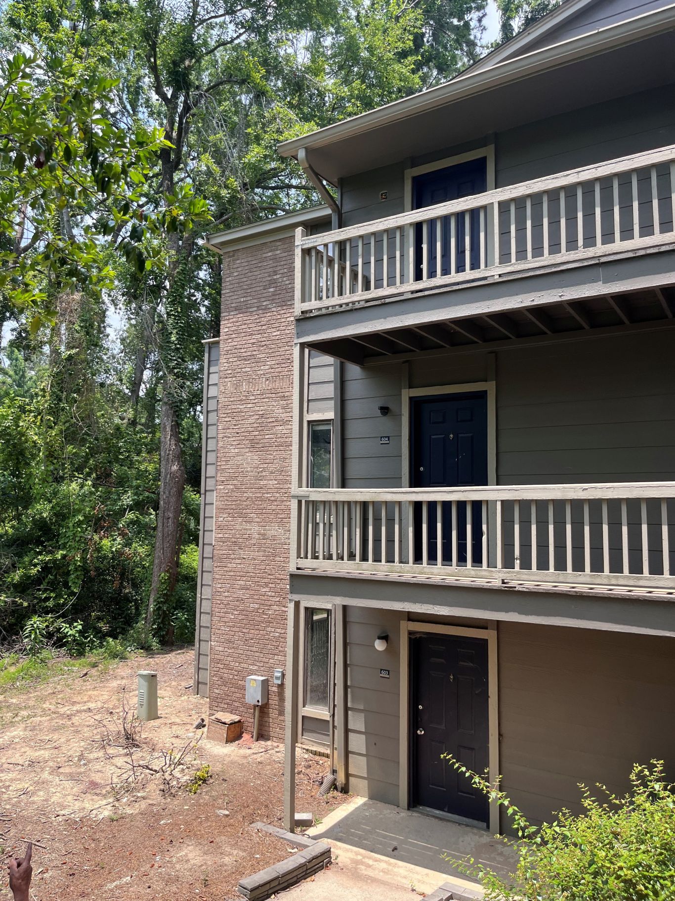 Woodhill Apartments tree damage exterior brick repair